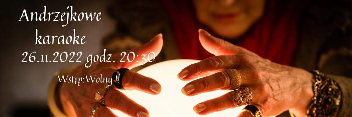 Dłonie kobiety położone na świecącej kuli, a obok biały napis "Andrzejkowe karaoke 26.11.2022 godz.20:30 Wstęp wolny"
